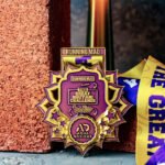 Great Biriyani Challenge for Charity Run medal of Honour Against Rustic Brick Wall