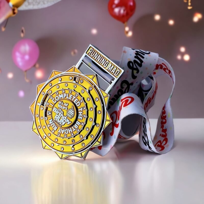Gold birthday-themed running medal with festive ribbon
