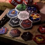 Assorted superhero running medals with vibrant enamel colors