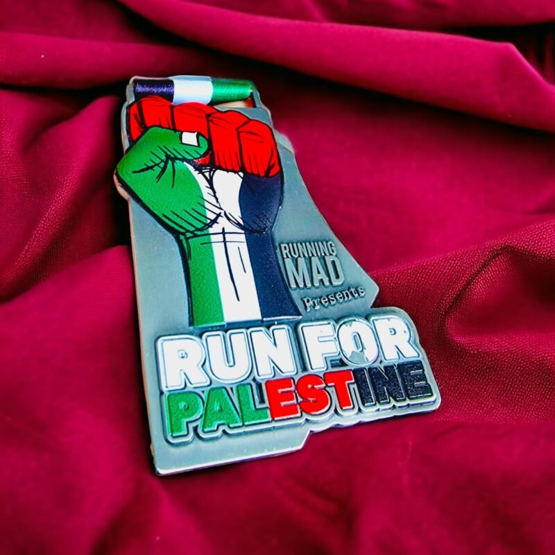 Run for Palestine medal with warm backdrop