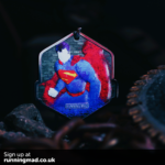 Superman emblem on running medal with a heroic blue and red color scheme.