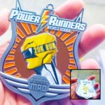 Power Runners Yellow 20K Run medal in grasp