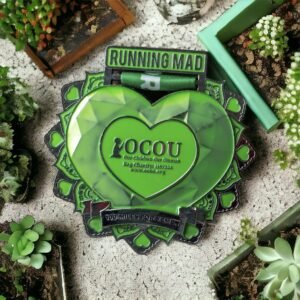 Commemorative green heart medal from Running Mad for the OCOU