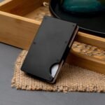 Black Ultra-Slim Metal Wallet on Wooden Table